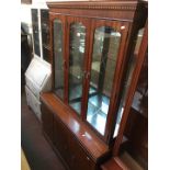 A mahogany lounge display cabinet