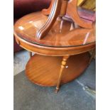 A 2 tier mahogany oval coffee table