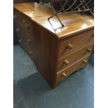 A pair of pine bedside cabinets