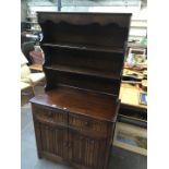 An oak linen fold dresser with plate rack back