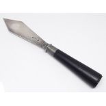 A late Victorian silver plated knife with ebony handle in the manner of Christopher Dresser, Hukin &