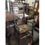 A 19th century rush seated rocking chair