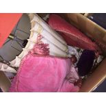 A large box with contents to include a ceiling light fitting, cushions, etc
