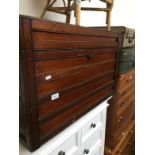 An early 20th century mahogany domed top chest with brass handles