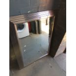 A large silver mirror