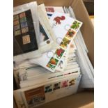A box of approx. 400 first day covers and a few loose stamps.