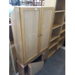 An oak 2 door cabinet