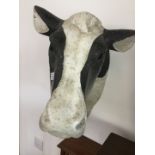 A composition cast cows head