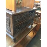 A hardwood eastern style cabinet with carved front