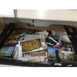 A box of photographs and postcards.