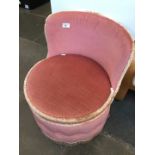 A pink tub chair