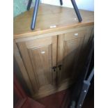 A pine corner cabinet