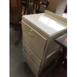 A white painted tall chest of drawers