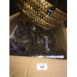 Box of glass centrepieces and a basket