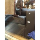 A dark brown leather sofa bed