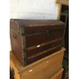 A Vintage metal bound domed top trunk