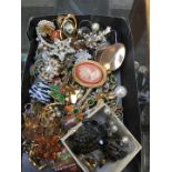 A box of misc vintage and modern jewellery to include brooches, hat pins, earrings, etc