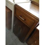 A 1930s Art Deco oak bedside cabinet with bakelite and chrome handles.