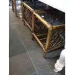 A pair of cane glass top tables