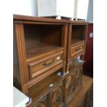 A pair of reproduction bedside cabinets