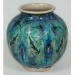 An Iznik style pottery vase, indistinct marks to base, height 18cm. Condition - minor crazing