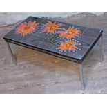 A retro abstract tile top coffee table, length 93cm.