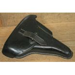 A German WWII black leather P38 pistol holster, marked with swastika eagle and dated 1941.
