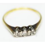 A three stone diamond ring, band marked '434', gross wt. 2.1g, size M.