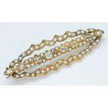 A Victorian pearl and diamond brooch, length 50mm, unmarked, gross wt. 10.4g.