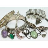 A mixed lot of hallmarked and other silver comprising two bangles, two bracelets, an Arts & Crafts