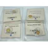 A group of four 14ct gold commemorative proof coins.