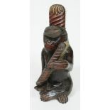 A novelty carved wooden brush holder circa 1900, formed as a chimpanzee wearing a schoolboy cap