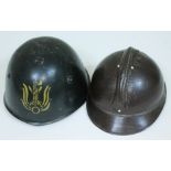 A French WWI helmet and an Italian WWII helmet.