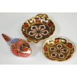 Three pieces of Royal Crown Derby comprising two small dishes and a bird.