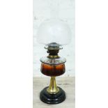 A Victorian brass column oil lamp with pottery base, cut glass reservoir and etched glass shade,