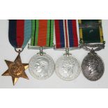 A WWII group of four, the Efficient Service medal inscribed '823487 GNR K.D. Bateson RA'.