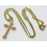 A 9ct gold crucifix pendant on 9ct gold chain, wt. 7.9g.