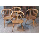 A set of four Ercol elm seated spindle back cow horn armchairs.