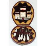 A cased Victorian mother of pearl sewing accoutrements set.