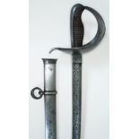 A Spanish 19th century cavalry sword, the blade etched 'Fabrica De Toledo 1871', with scabbard,