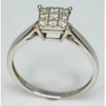 A 9ct white gold diamond cluster ring, comprising nine round brilliant cut diamonds, total approx.