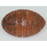 A carved coquilla nut, length 7cm.