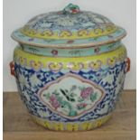 A Chinese porcelain famille rose jar and cover, height 22cm. Condition - chip and missing piece to