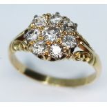 A late Victorian diamond cluster ring featuring eight old cut diamonds, cluster diam. 10mm,