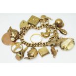 A hallmarked 9ct gold charm bracelet, various hallmarked 9ct gold charms and one hallmarked 22ct