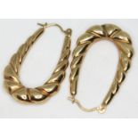 A pair of 9ct gold earrings, marked '9ct', length 32mm each, wt. 1.7g.