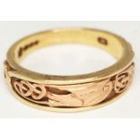 A hallmarked 9ct gold with Celtic style design, wt. 6.9g, size V.