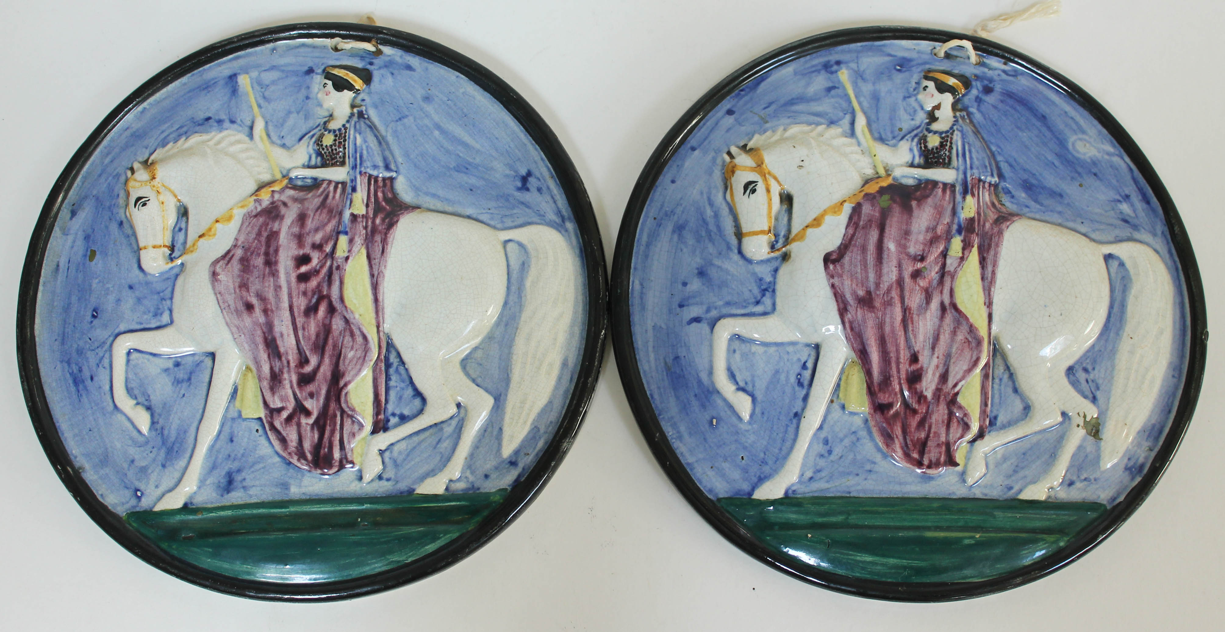 A pair of Portobello earthenware plaques, 19th century, diam. 23.5cm each. Condition - good, each