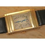 An Art Deco style 9ct gold watch, 15 jewel movement, case length 34mm, later leather strap.
