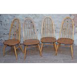 A set of four Ercol blonde elm and beech spindle back chairs.